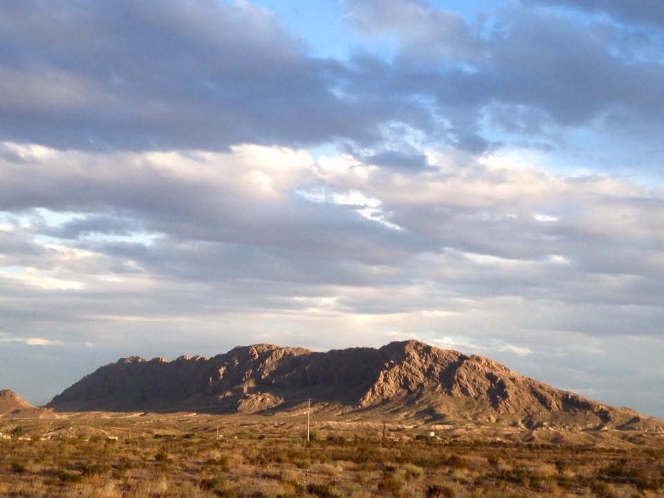 Rugged desert mountain range under a cloudy sky at dusk near Presidio, Texas